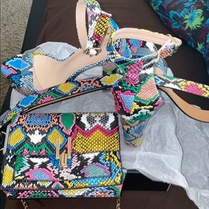 A purse a belt and some heels